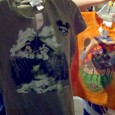 Epcot’s Scratch ‘N Sniff Soarin’ T-shirts Bring the Magical Scents Home! Last week while exploring the merchandise area outside of Soarin’ (aka the Green Thumb Emporium – thanks to @mousemisers for that name that slipped my mind), a bright orange kid’s shirt caught my eye. I picked it up and realized it had a big “Scratch ‘n Sniff” sticker on it....