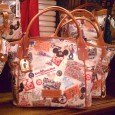 NEW! WDW 40th Anniversary Disney Dooney & Bourke Purses It’s time again for another set of new Disney Dooney & Bourke designs! Many thanks to Shelley C. for snapping these pictures today on the first day of the new Walt Disney World 40th Anniversary Dooney & Bourke designs! Now lets get right to the pictures! (As always, click to enlarge...