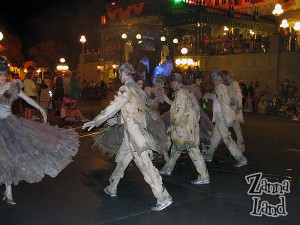 Ghoulish party-goers dance onto the scene-I love the moves they do!