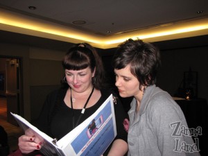 Disney Mom's Amy R. and Amanda W. reading our training binder.